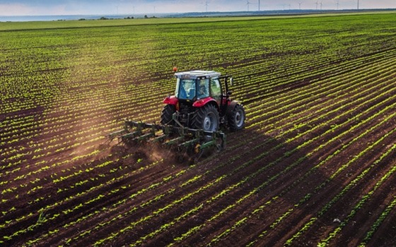 Agriculture sector - Tractor ploughing field