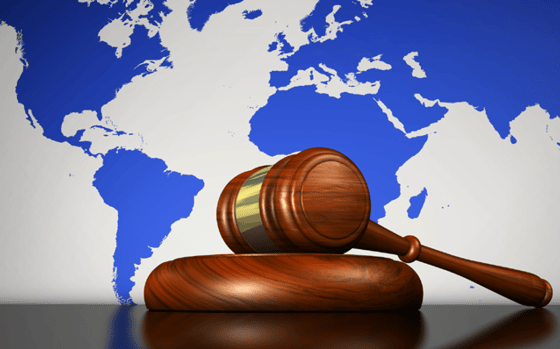 International law - Gavel in front of world map