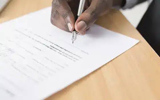 someone signing a legal document