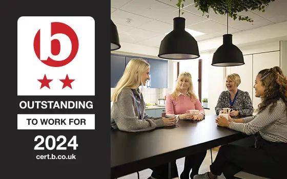 Two star best companies outstanding to work for 2024 logo alongside a group of employees