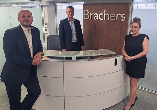 Partners Lee May, James Bullock and Alexandra Gordon in the reception of Brachers' Canterbury office