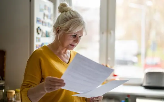 A lady reading through some documents