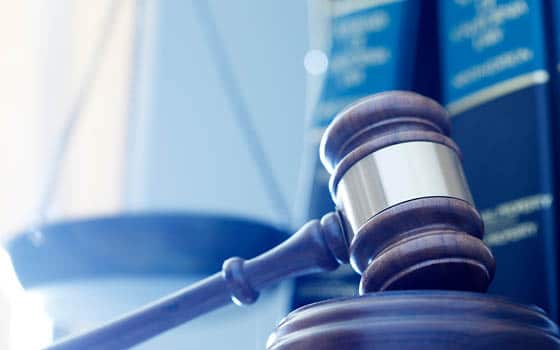 A gavel resting on a sound block