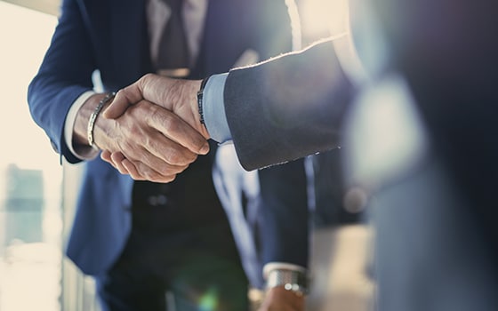 Shaking hands as a business deal is agreed