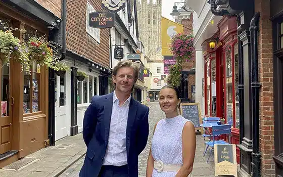 joshua williams and sophie read standing in canterbury street with canterbury cathedral in the background