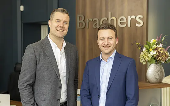 matthew simmonds and dan king standing in brachers llp reception