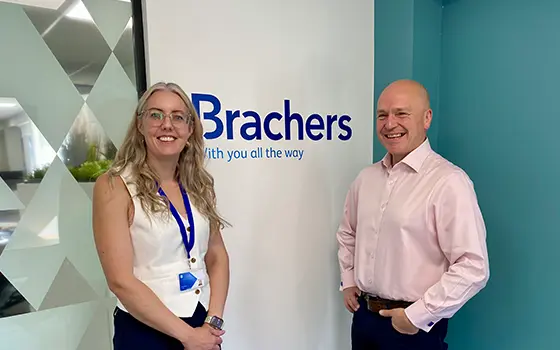 commercial litigation senior associate nicola webster standing alongside commercial litigation partner michael oatham in a brachers meeting room