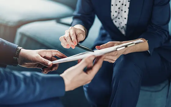 two people reviewing a contract