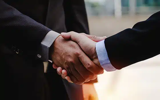 Close up of two business people shaking hands